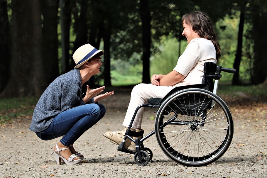 Woman on Black Folding Wheelchair, active, adult, disability