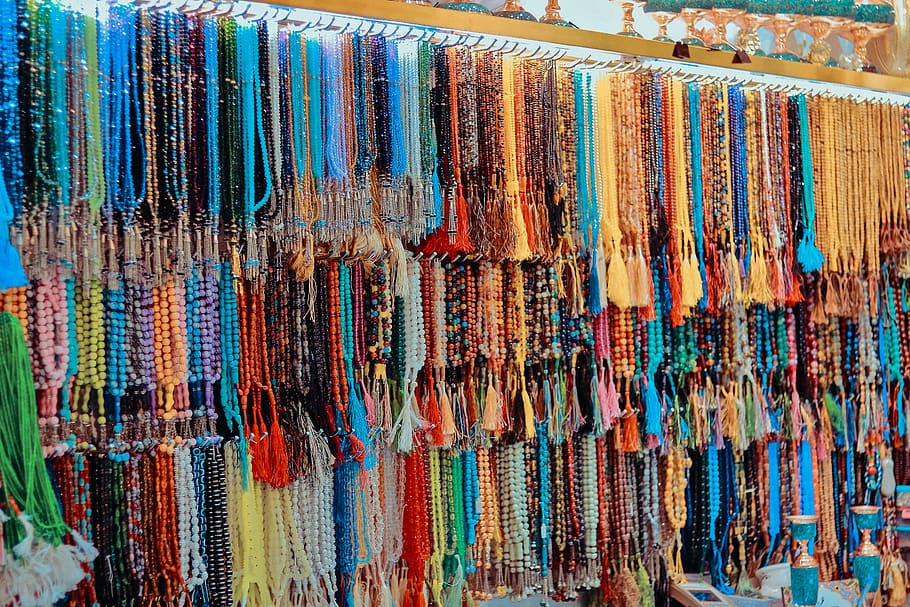 assorted-color prayer beads hanging on rack lot, accessories