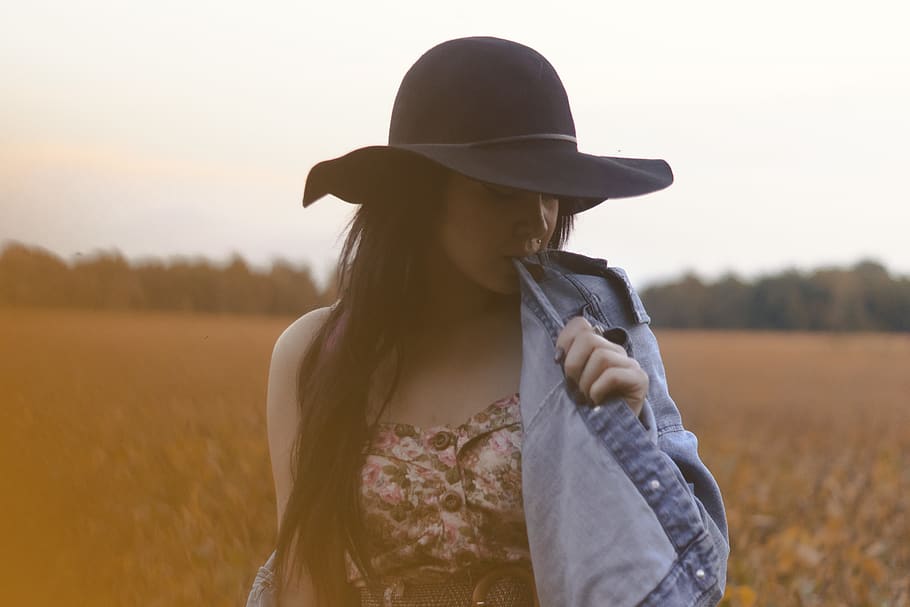 Selective Focus Photography of Woman Biting Her Denim Jacket HD wallpaper