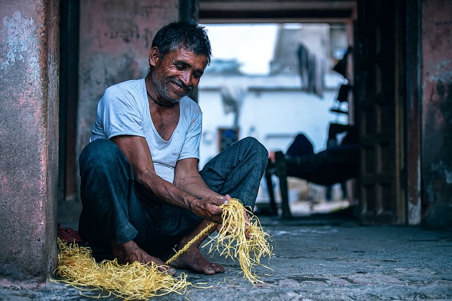 Man Holding Yellow String, blur, close-up, day, hands, looking HD wallpaper