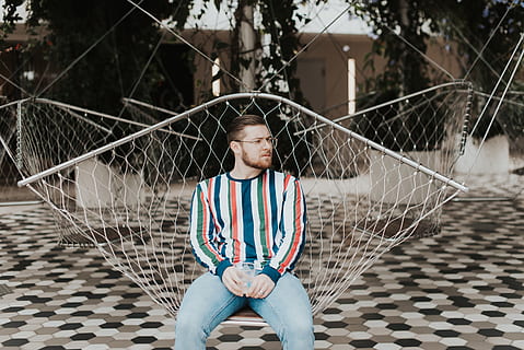 man sitting on hammock, human, person, furniture, sphere, clothing HD wallpaper