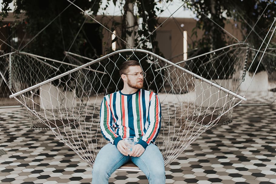 man sitting on hammock, human, person, furniture, sphere, clothing HD wallpaper