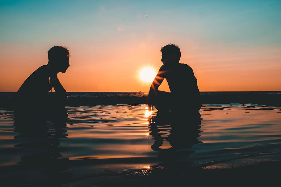 Photo of Two Men on Seashore during Sunset, afterglow, backlit HD wallpaper