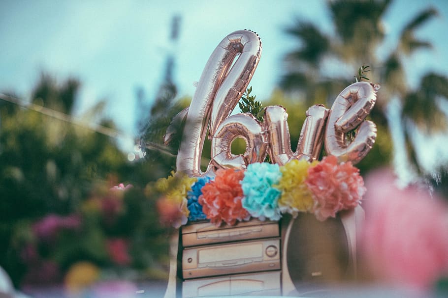 silver love balloons on top of stereo in macro photography, flower HD wallpaper
