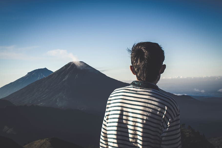 Man Wearing Striped Shirt Looking At Volcano, adventure, climb