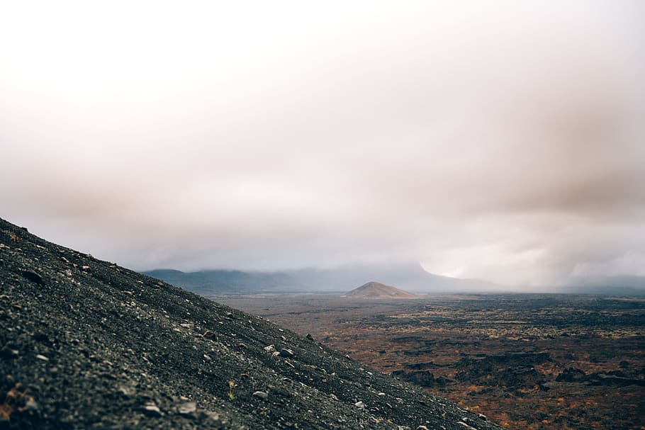Crumbling volcanic hillside on a cloudy day, Desert, Eruption, HD wallpaper