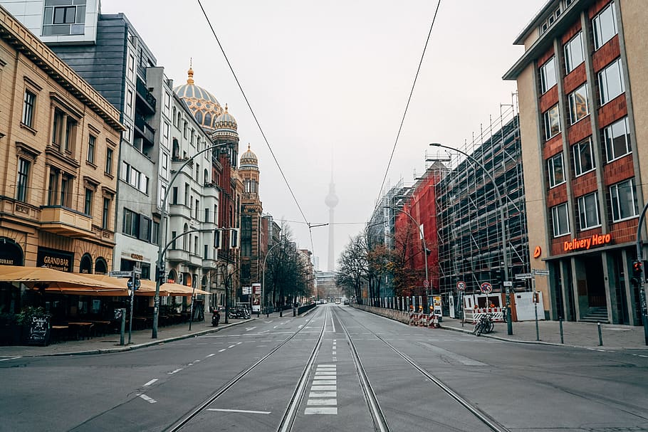 empty road between buildings during daytime, tarmac, asphalt HD wallpaper