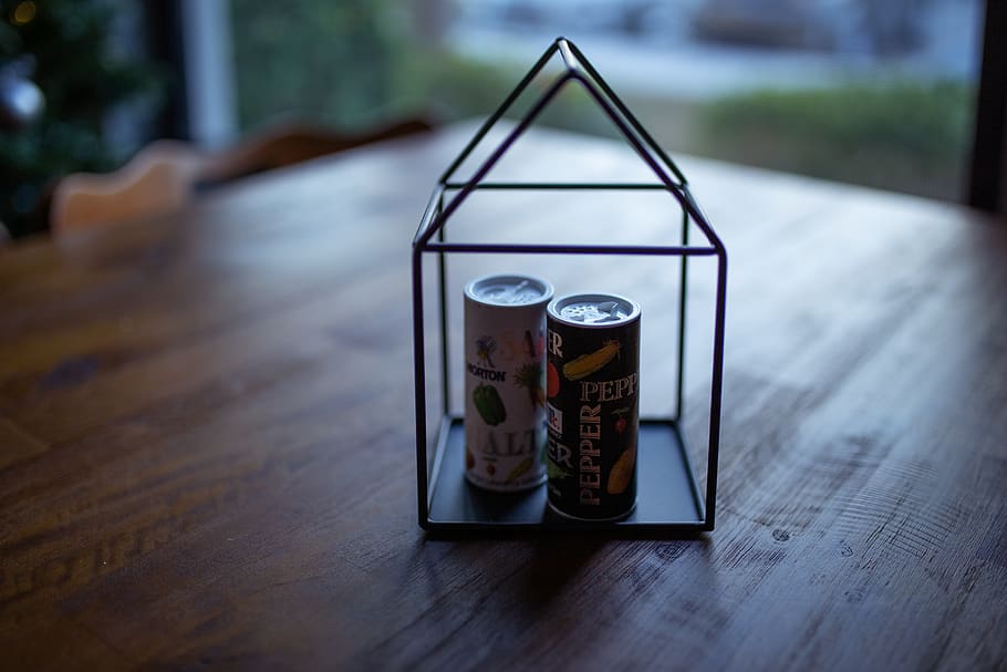 Two Labeled Thin Cans on Black Frame, blurred background, caffeine HD wallpaper