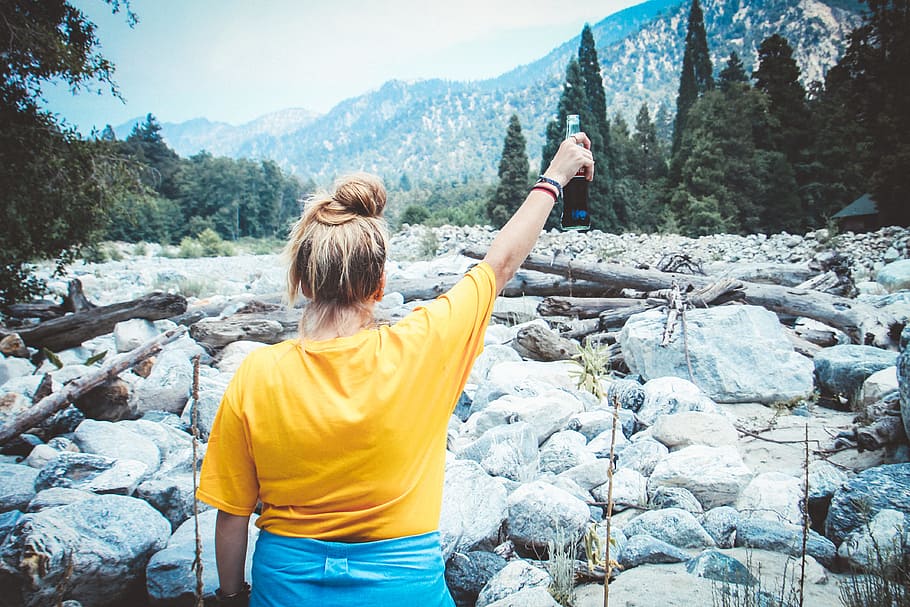 Woman in Yellow Shirt Holding Cola Bottle, boulders, daylight HD wallpaper