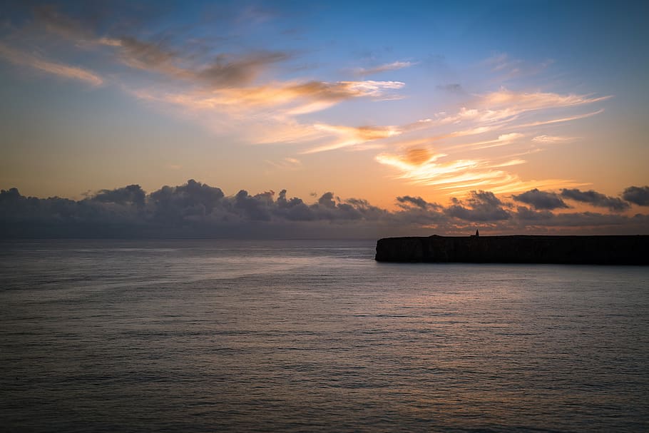 sunset, horizon, lighthouse, landscape, sky, dawn, orange, water HD wallpaper