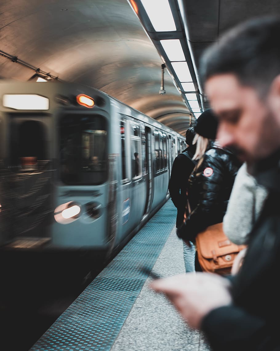 Man Using Smartphone, blurry, commuter, people, public transportation HD wallpaper