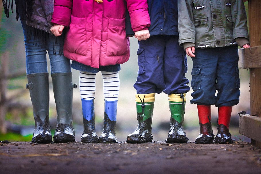 four children standing on dirt during daytime, person, people