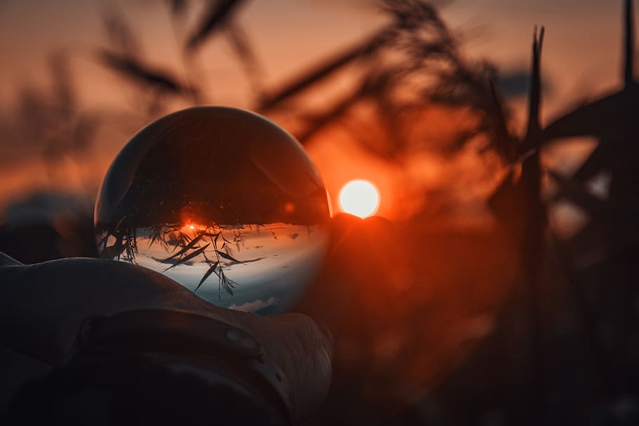 Person Holding Snowglobe, action, backlit, blur, dawn, hand, light HD wallpaper