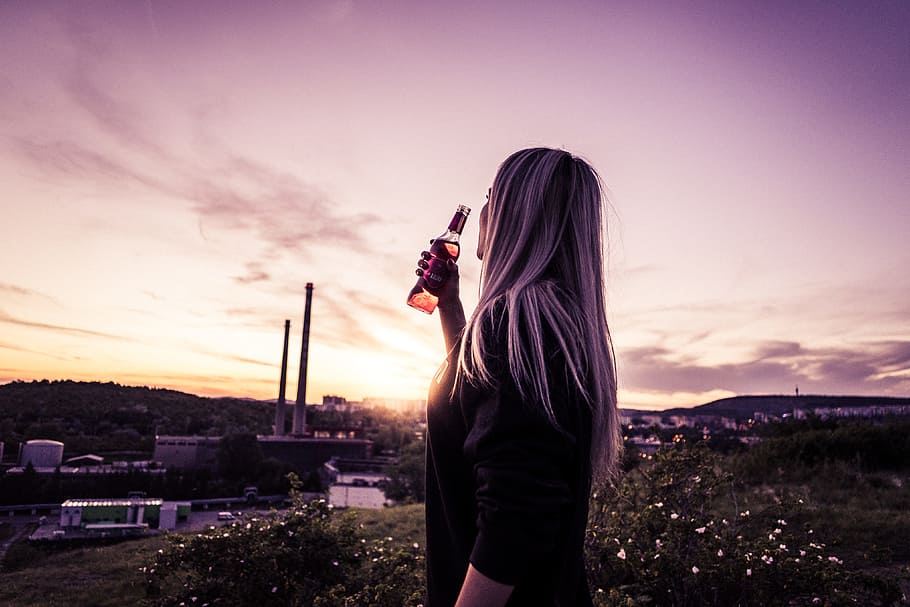 Young Woman Enjoying a Drink in Sunset, alcohol, chill out, cider