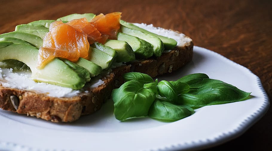 Bread With Sliced Avocado and Salmon Near Basil Mint on Plate HD wallpaper