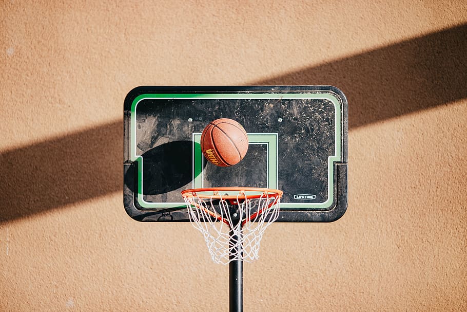 ball on hoop, basketball, net, throw, sunlight, shadow, minimalism
