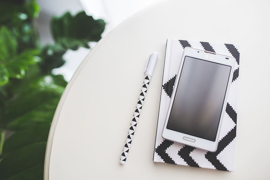Top view of mobile phone with empty screen, mockup, notebook HD wallpaper