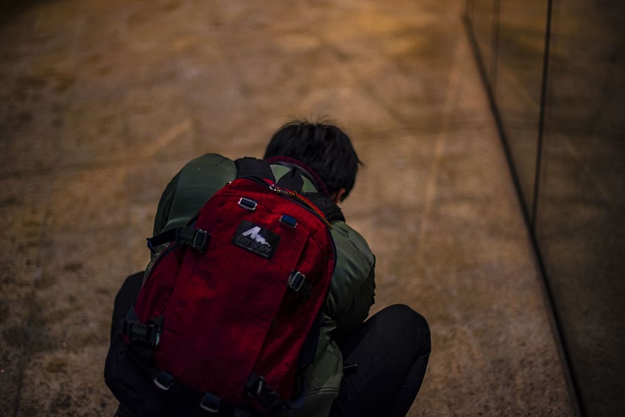 man wearing black backpack, bag, outdoors, person, human, wood HD wallpaper