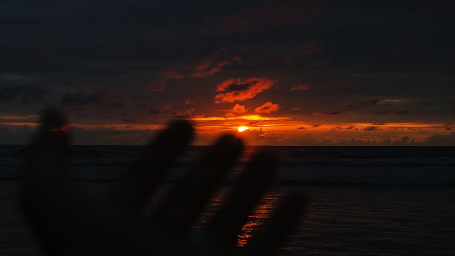 Person's Hand With Over-view of Sea at Golden Hour, beach, clouds HD wallpaper
