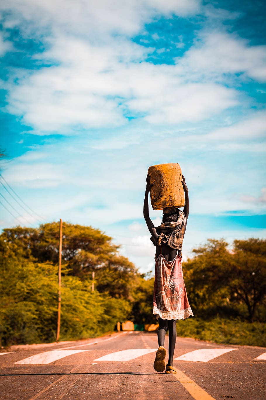 Person Carrying Container on the Head on Road, african, beautiful