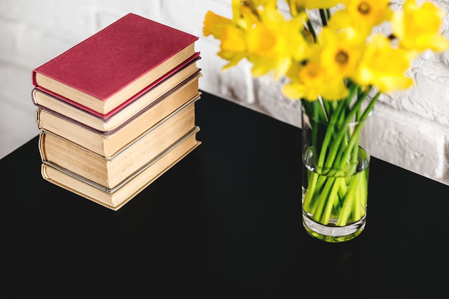 Hardbound Books Beside Yellow Petaled Flowers, bloom, blossom