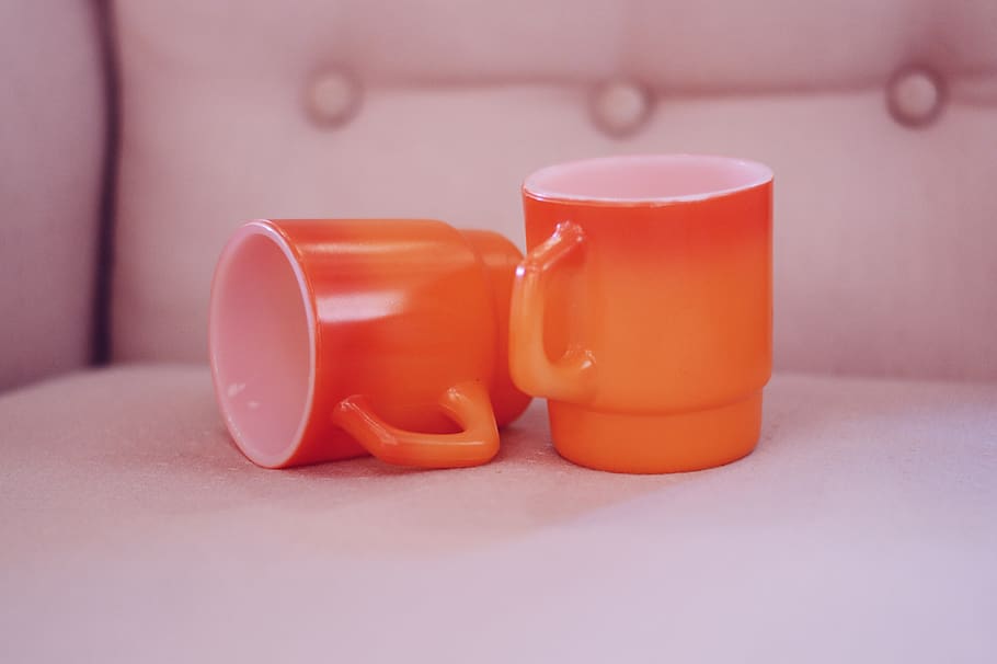 two empty orange-and-white mugs, indoors, no people, close-up HD wallpaper