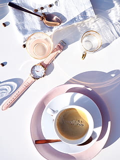 White Ceramic Cup on Saucer Near Gold-colored Analog Watch on Table HD wallpaper