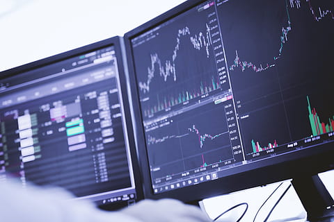 Trader working on pc with graphs and diagrams on monitor, technology HD wallpaper