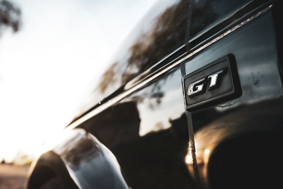 black vehicle, close-up, focus on foreground, day, human hand HD wallpaper
