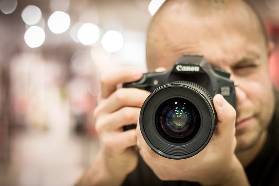 Man Taking Photo With Canon Black Camera, dslr, lens, person, HD wallpaper