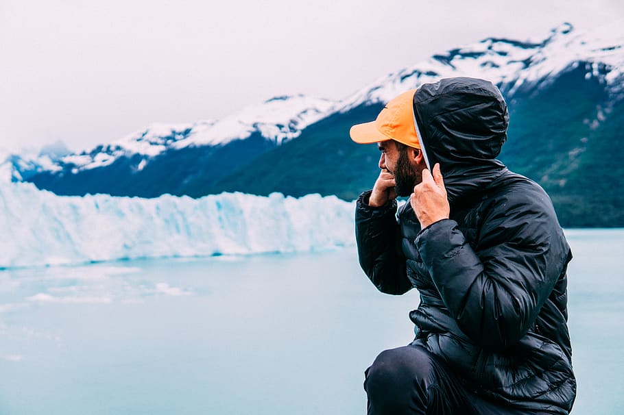 man surrounded by snow wearing black bubble jacket, one person HD wallpaper