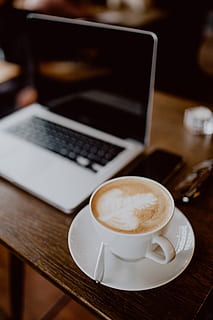Cup of coffee on table in cafe, interior, tech, technology, work HD wallpaper