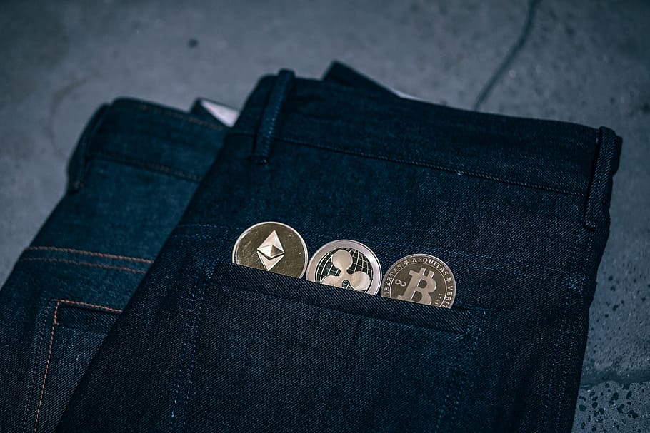 Physical Gold-Plated Cryptocurrencies Coins. Top 3 Cryptocurrencies Placed Half Inside a Pair Denim Jeans. HD wallpaper