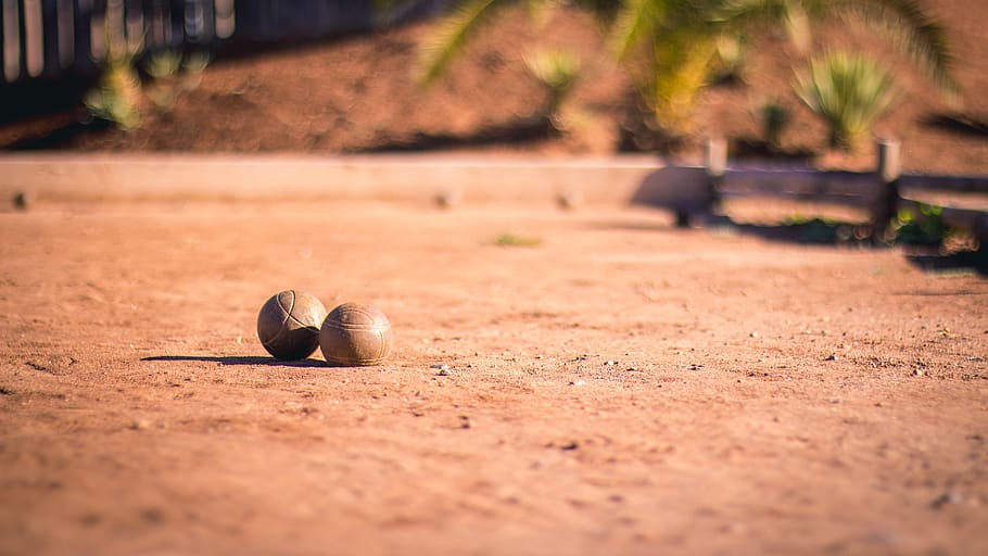 brown pavement, ball, sphere, ground, sports, golf ball, boule HD wallpaper