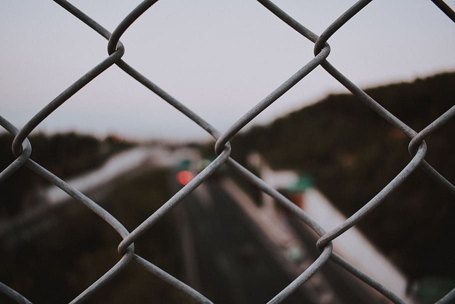 closeup photo of grey fence, blur, road, chain, forest, chainlink fence HD wallpaper