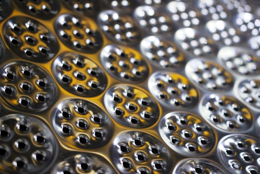 Abstract futuristic background of metallic cogs and wheel shapes in light and shadow HD wallpaper