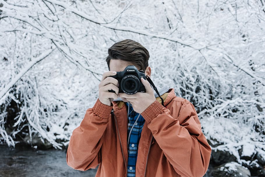 man using black DSLR camera, winter, cold temperature, photography themes HD wallpaper