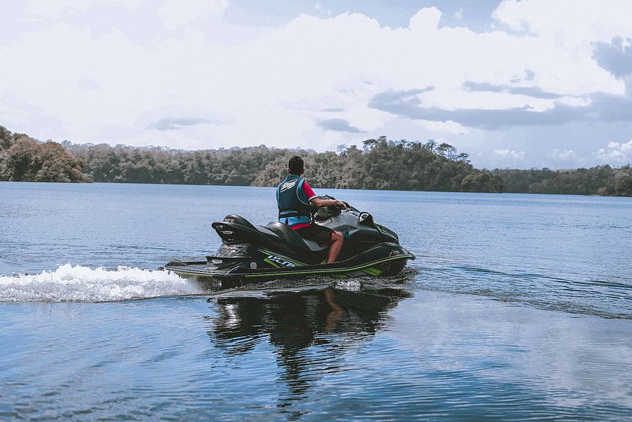 Man Riding on Green Personal Watercraft on Body of Water, action HD wallpaper