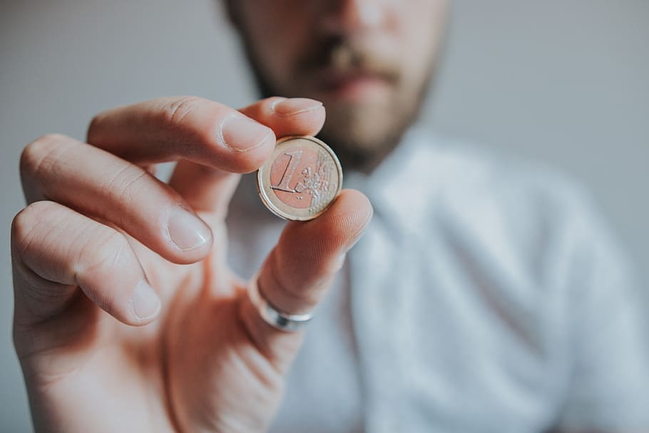 Person Holding Round Gold-colored Coin, beard, blurred background HD wallpaper