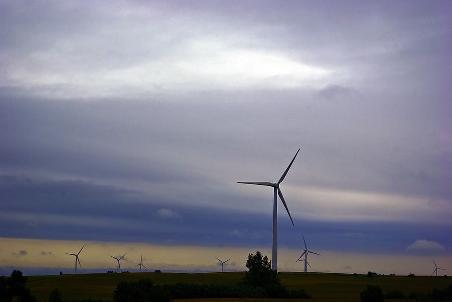 wind turbines against dark clouds, power, energy, sky, nature HD wallpaper