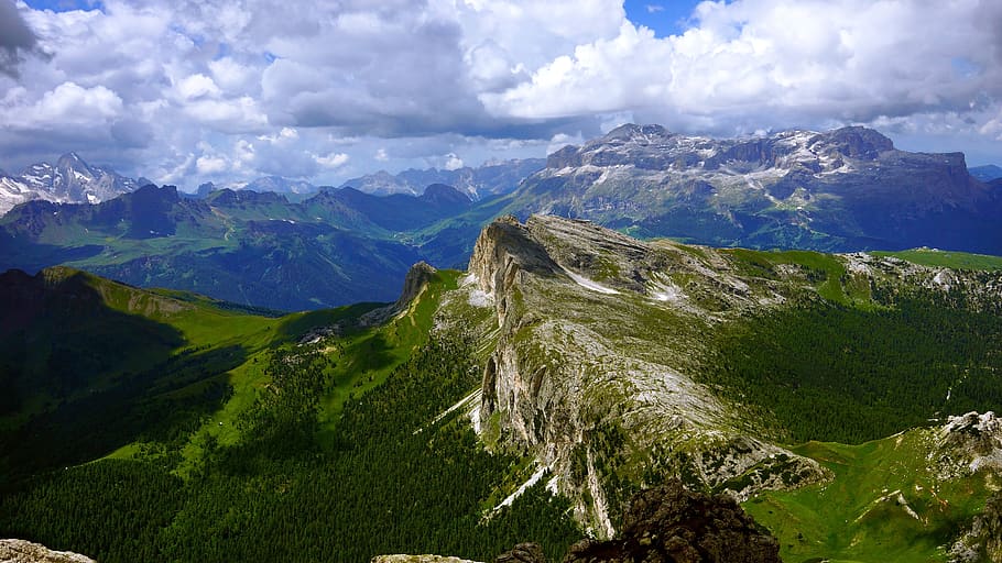 white fluffy clouds hovering over mountain peaks, nature, outdoors HD wallpaper