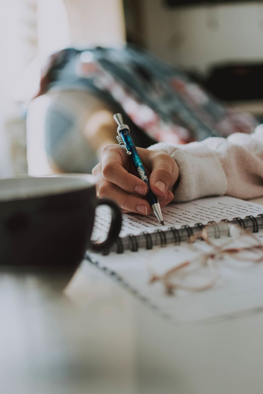 Person Sketching on Paper, blurred background, cup, desk, hand HD wallpaper