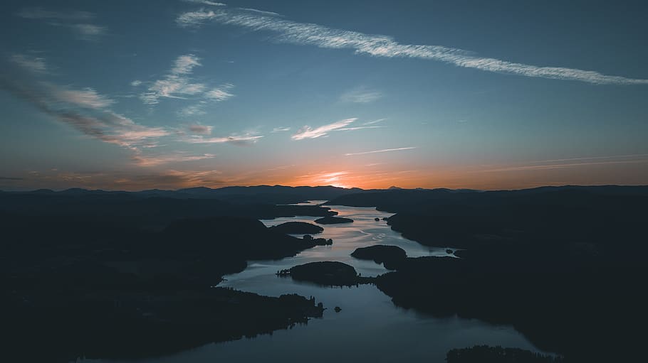 Aerial Photography of Water Beside Forest during Golden Hour HD wallpaper