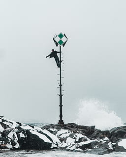 man climbing on pole, nature, outdoors, human, person, lamp post HD wallpaper