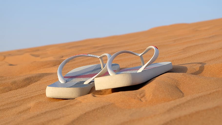 Pair of White Flip-flops on Focus Photo, close-up, desert, dune HD wallpaper