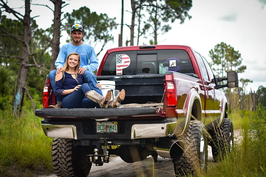 Man And Woman Sitting On Back Of Pickup Truck, car, couple, daylight