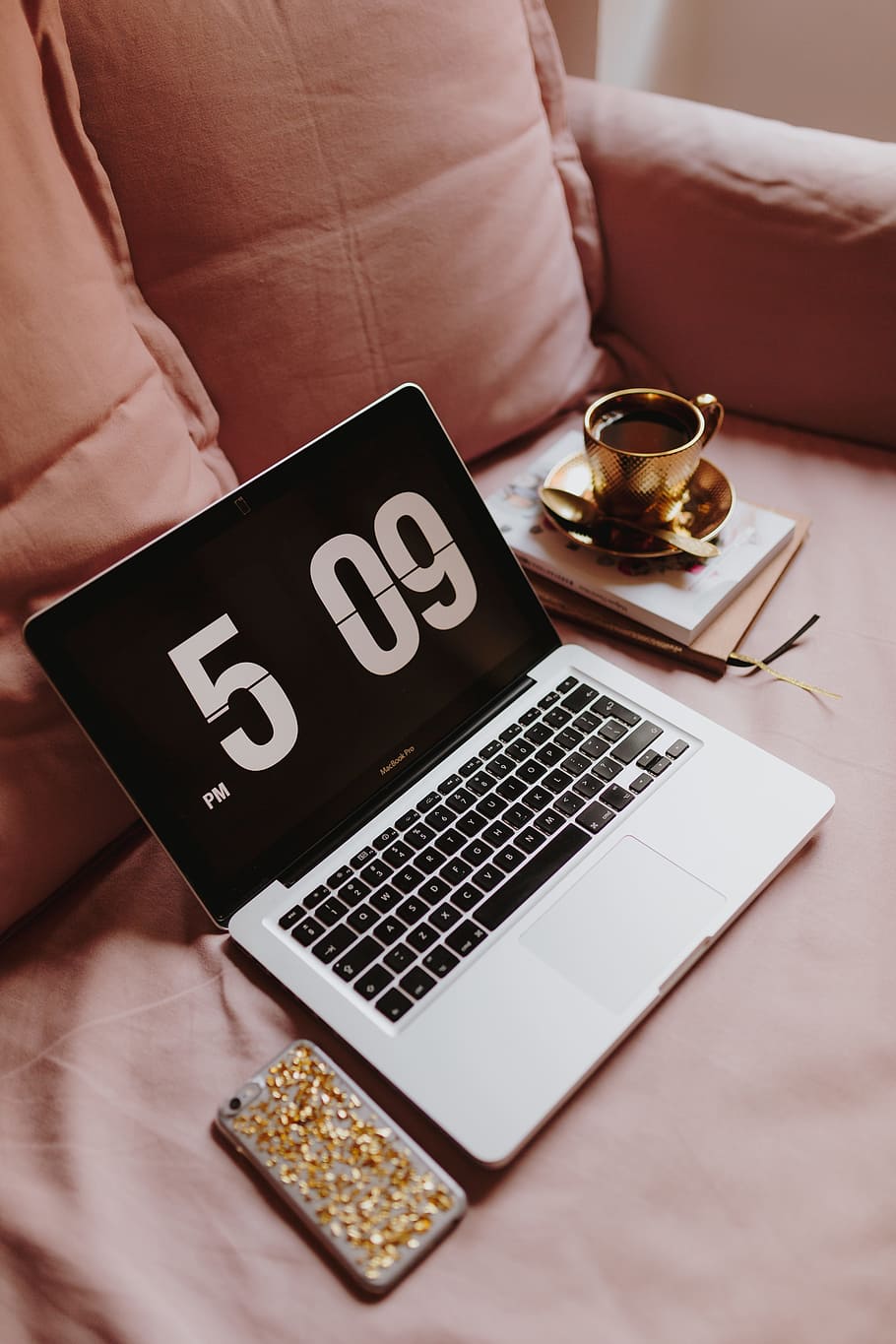 Workplace with a laptop on a pink couch, macbook, macbook pro HD wallpaper