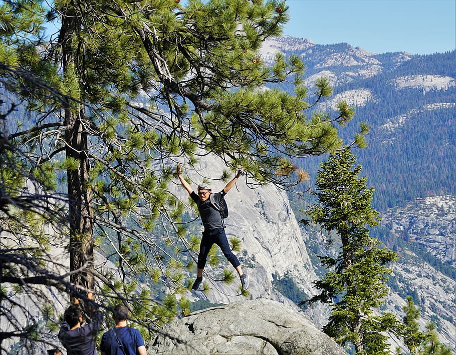 man standing on peak at daytime, real people, leisure activity HD wallpaper