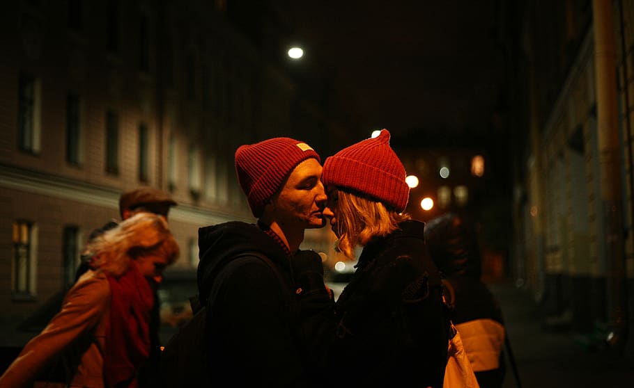 Man Kissing Woman's Nose Outdoor during Nighttime, blurred background HD wallpaper