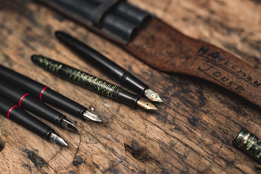 Close up view of a fountain pens, vintage, old, retro, wood, antique